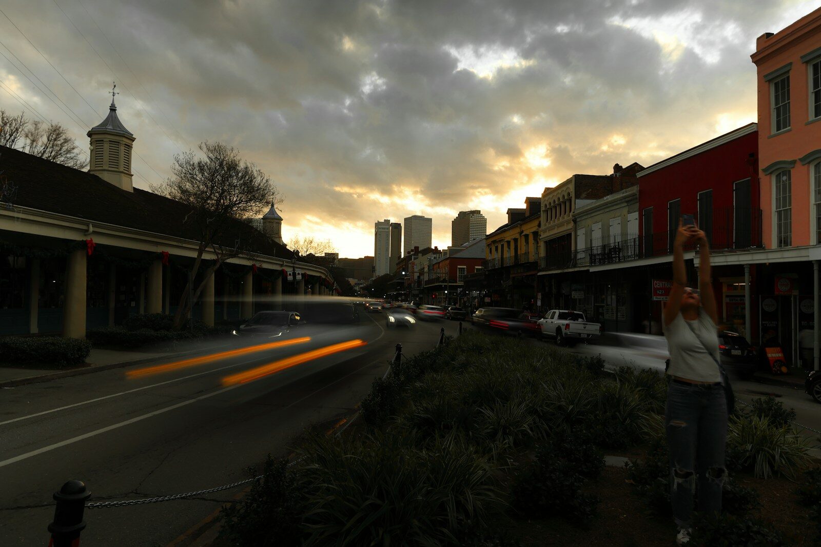 City street scene with a cloudy sunset.